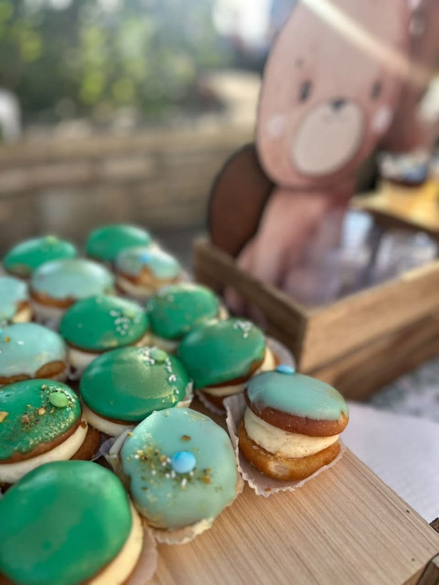 Christening donuts with the bear cut-out behind