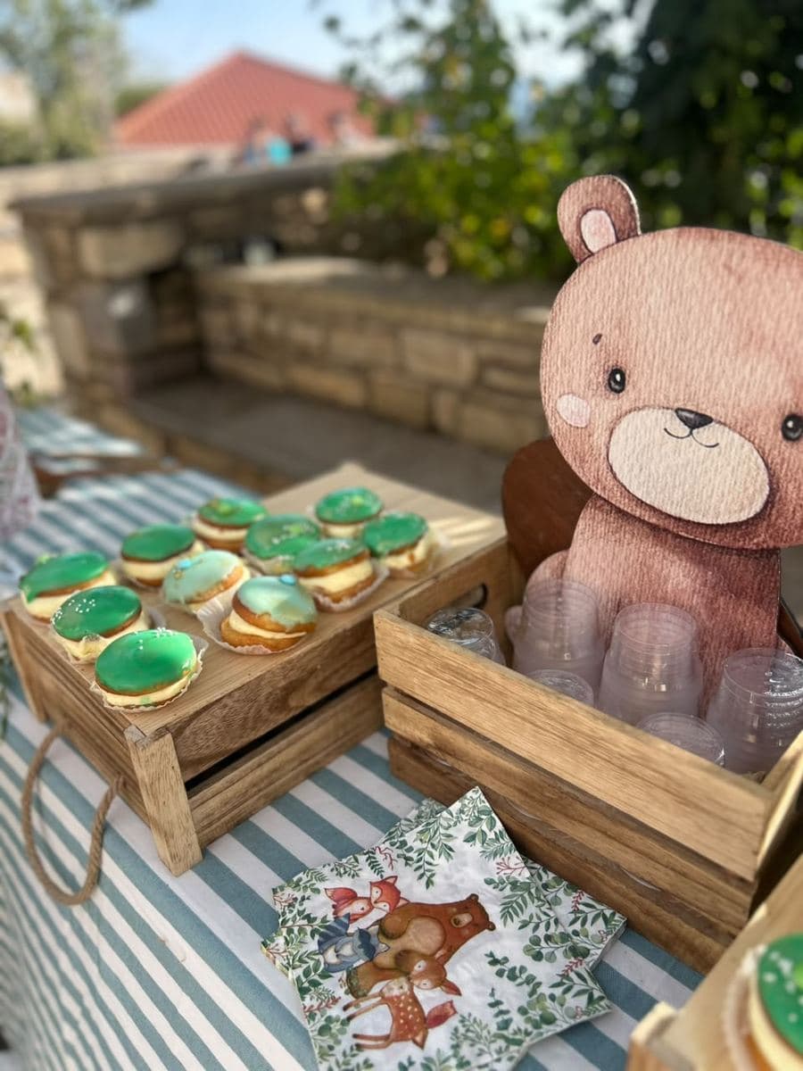 Wooden crates of sweets beside a bear cut-out