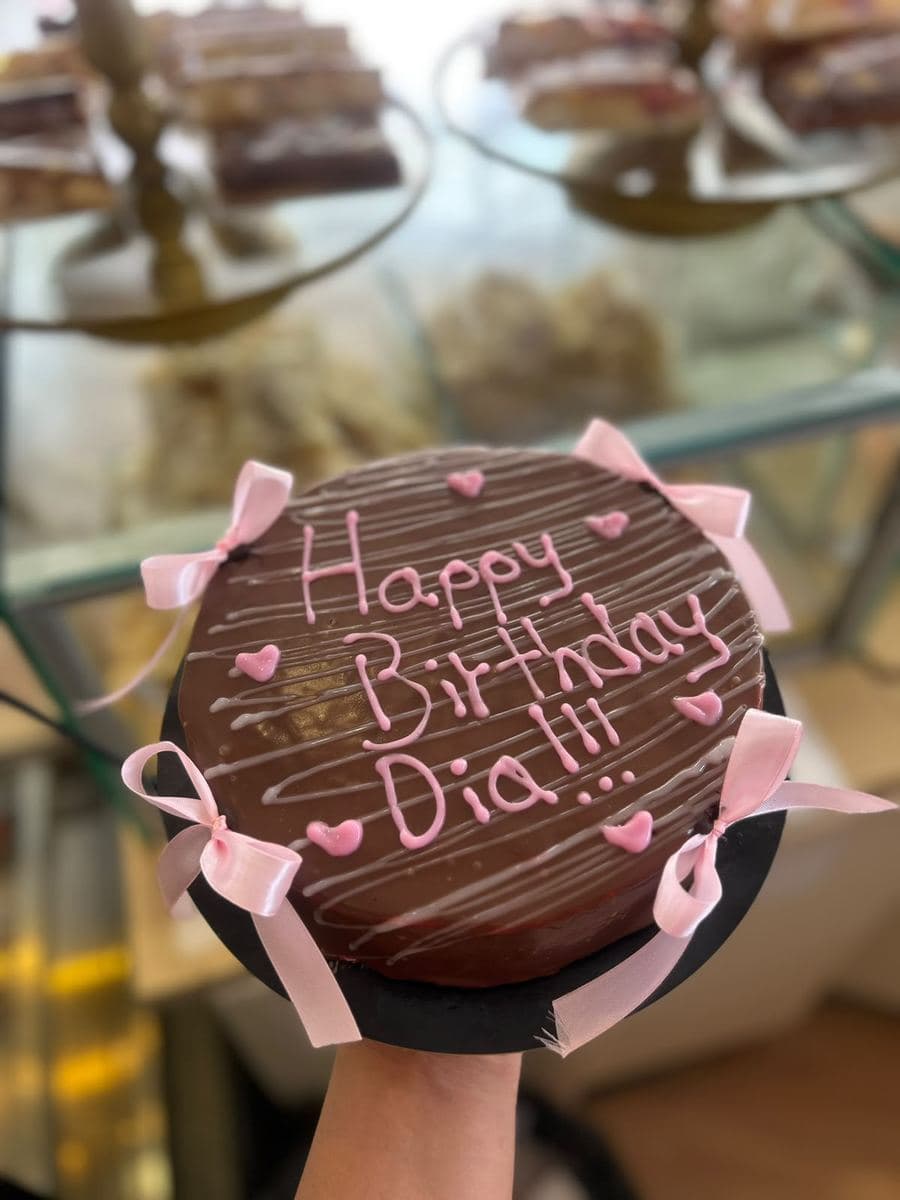 Chocolate birthday cake with pink detailing